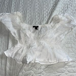 White crop top off the shoulders.